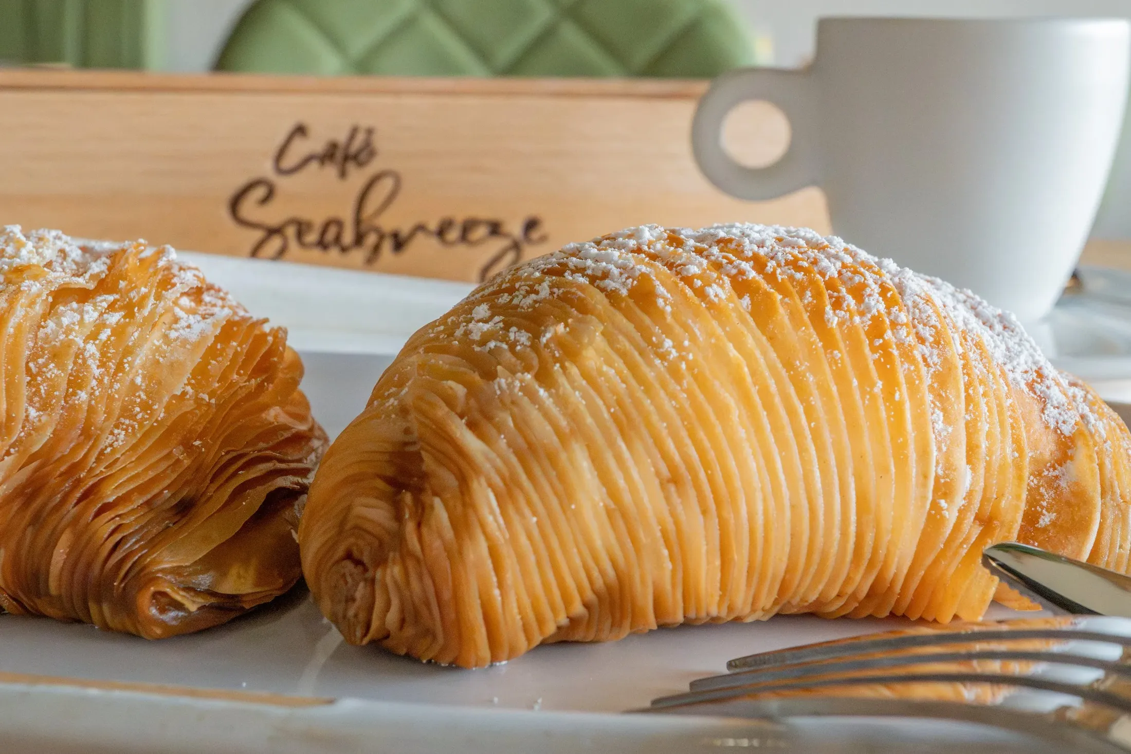 Sfogliatelle dusted with powdered sugar at Cafe Seabreeze
